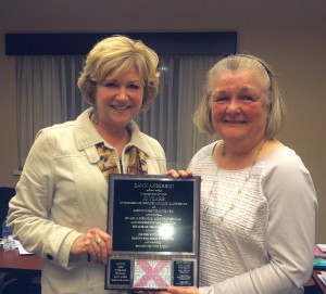 WBCC President Rhonda Deneka presents Dawn Anderson with a plaque in honor of Dawn's decade of service as Executive Director and her retirement in November